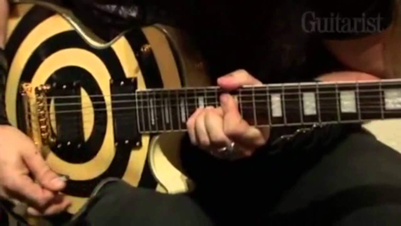 image of Zakk Wylde holding his signature style guitar